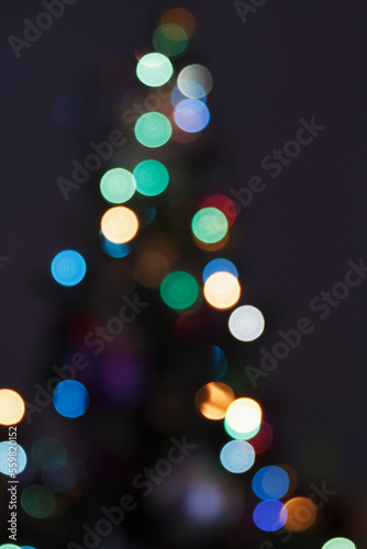 Blurred background, abstraction of a night holiday, party, multi colored lights, city life