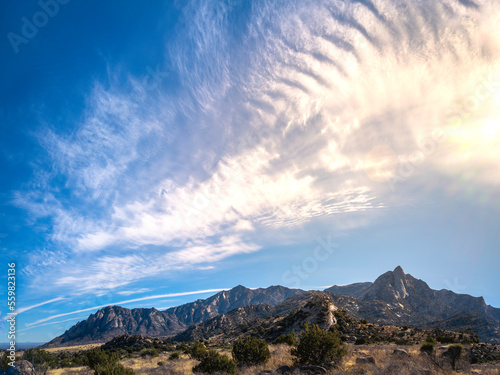 Organ Mountains-Desert Peaks National Monument cloudscape with sunrays in Las Cruces, Doña Ana County, New Mexico, Southwestern USA, dramatic cloudscape over the Sugarloaf Peak area. photo