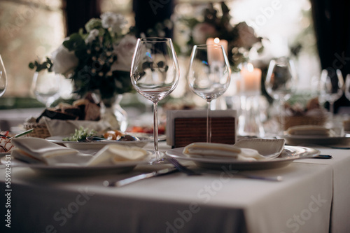beautiful wedding table setting with white wine and glasses