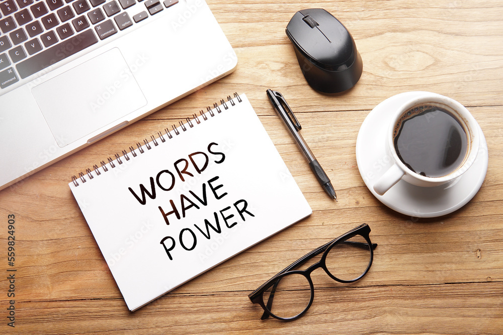 Words Have Power, motivational words and sentences for work and life. Quote sentence in notebook with laptop, pen, coffee over wooden background.