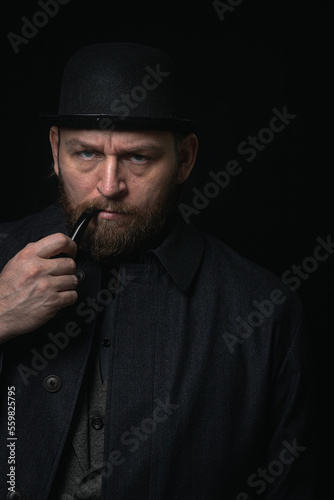 stylish man in retro outfit suit hat smoking wooden pipe sherlock holmes look cosplay england gentleman fashionable confident gangster Guy Ritchie Charlie Hunnam style photo