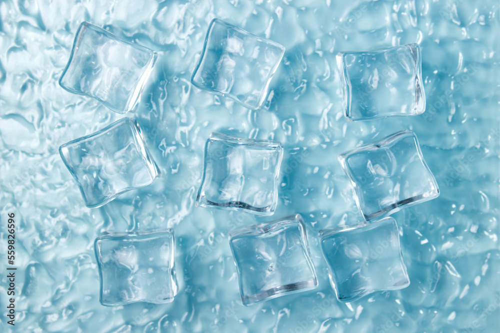 Ice cubes on the water on a blue background.