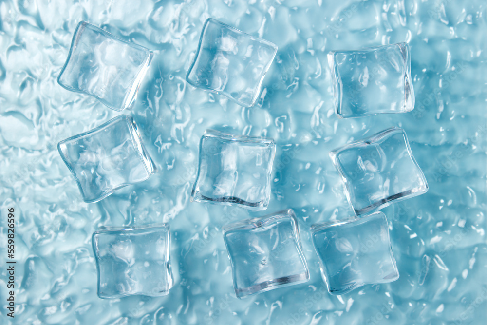 Ice cubes on the water on a blue background. Ice cubes on the water on a blue background.