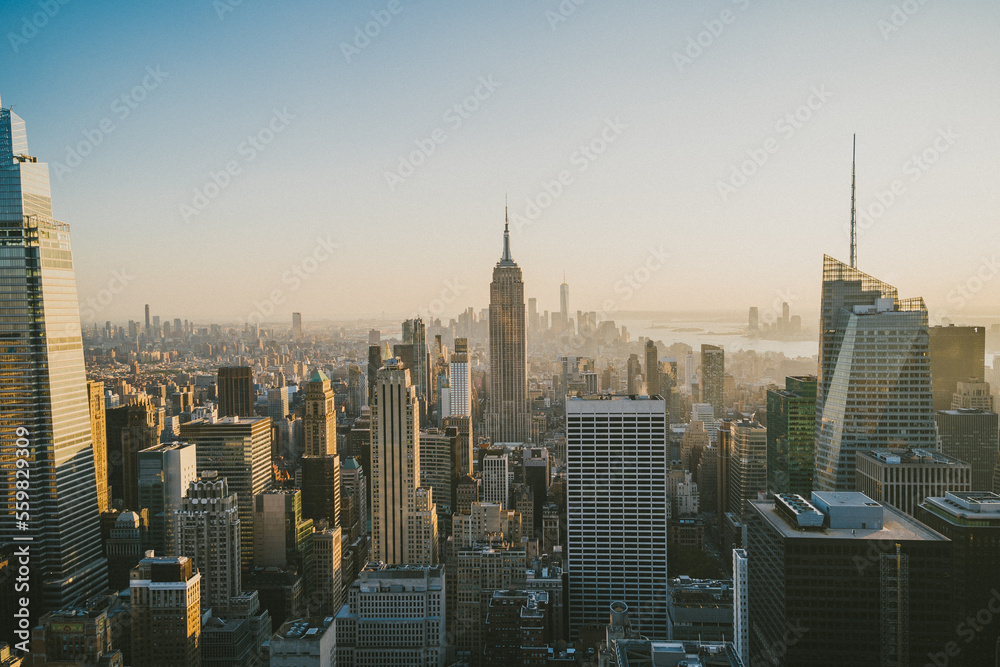 Modern skyscrapers with glowing lights in evening Modern skyscrapers with glowing lights in evening