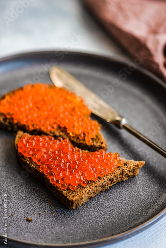 Toasts with red caviar photo