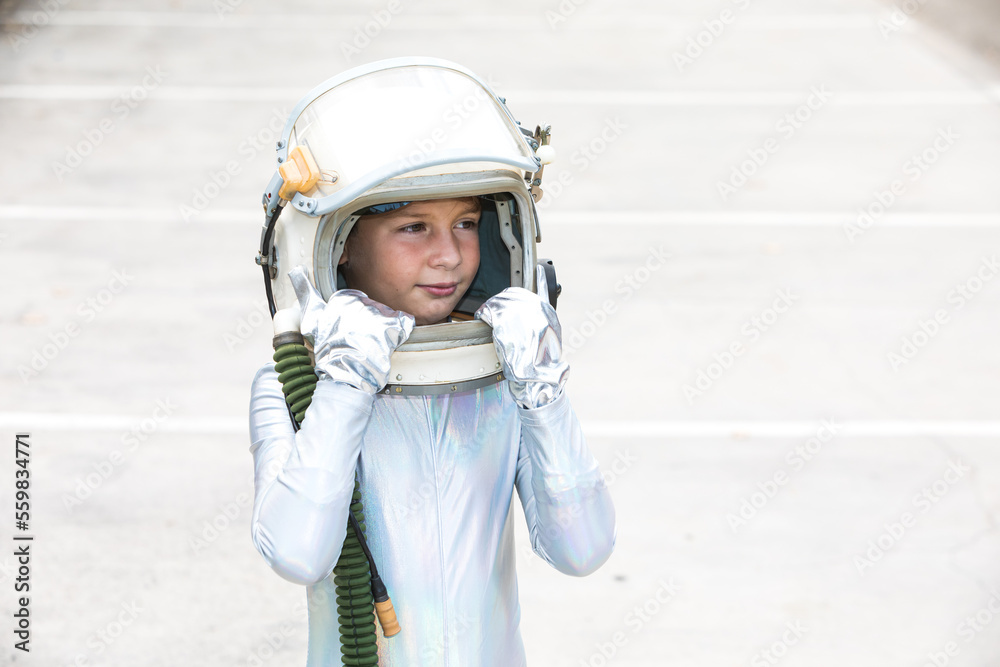 Boy in space suit looking away Boy in space suit looking away