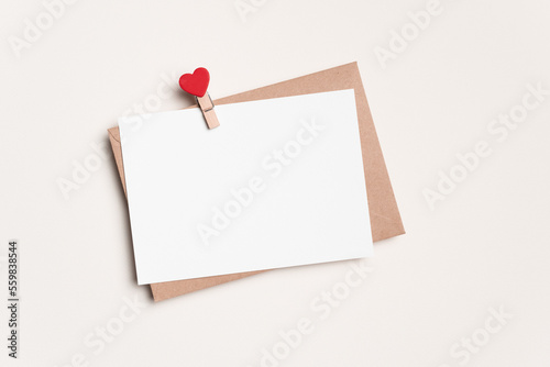 Valentines Day blank greeting card mockup with envelope and heart peg on white