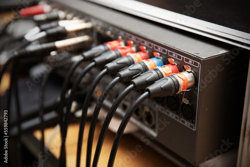 Music wires connected to amplifier. photo