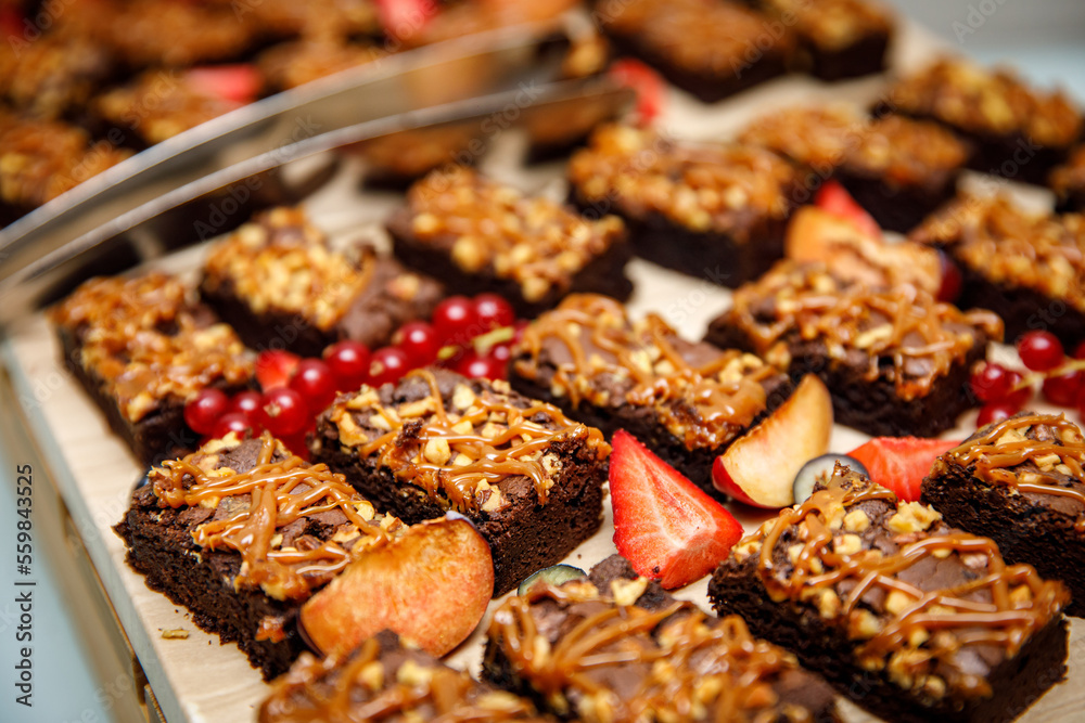 Set of brownies with nuts and salted caramel. Chocolate cake with nuts and caramel. Set of brownies with nuts and salted caramel. Chocolate cake with nuts and caramel.