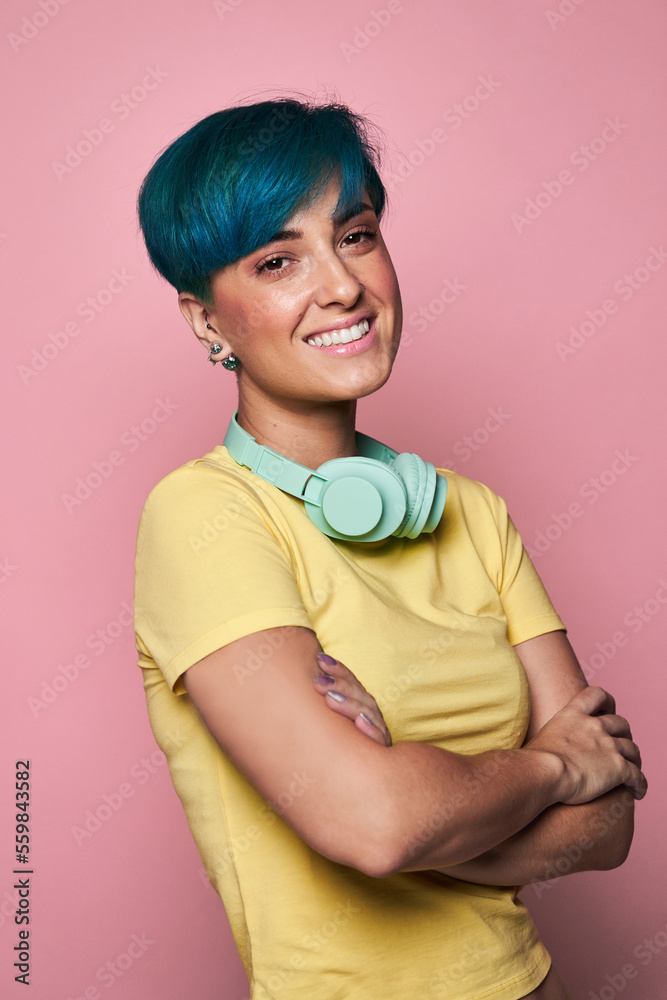 Cheerful woman in headphones looking at camera Cheerful woman in headphones looking at camera