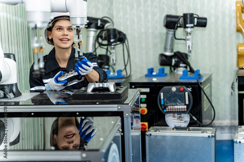 Team woman of engineers practicing maintenance Taking care and practicing maintenance of old machines in the factory so that they can be used continuously.