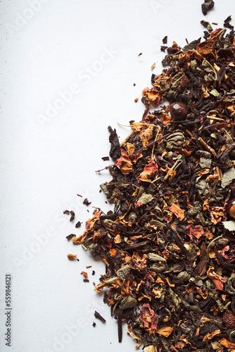 Dry tea leaves on surface photo