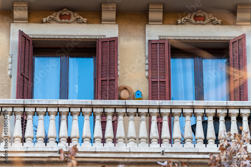 Photography The open balcony with windows on the facade of a residential building in the city of Barcelona