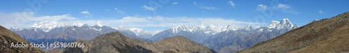 grass and sky Panorama of Himalayan mountain range visible from Kuari pass trek © pushpasen