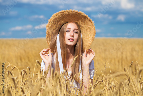 Young blonde model in wheat field