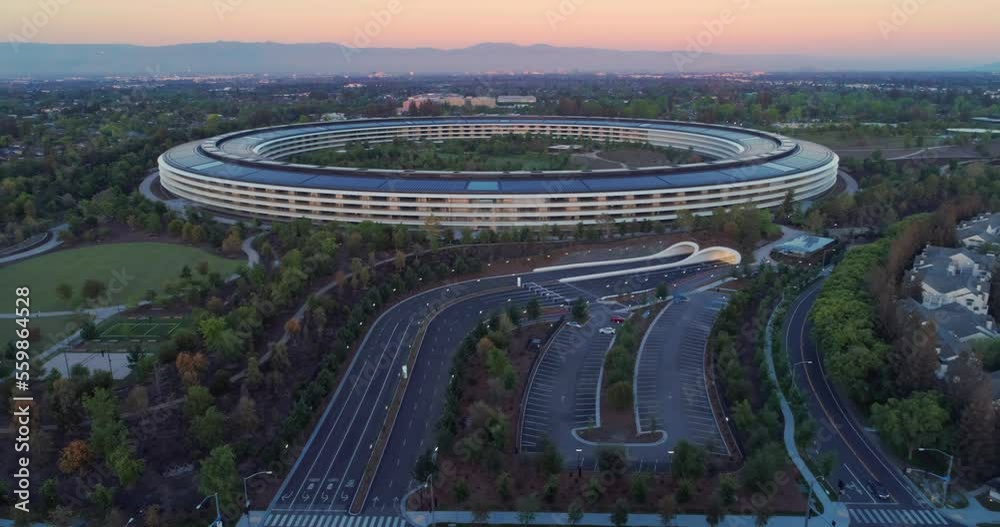Aerial: Apple Campus spaceship at sunrise in Sunnyvale / Cupertino Silicon Valley, California, USA. 21 April 2022