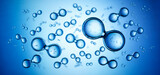 Models of hydrogen molecules floating against blue background - H2 scientific element