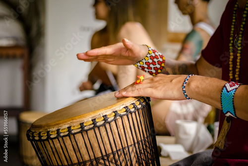 Cuadro en lienzo Sao Paulo, SP, Brazil - December 31 2022: Person with traditional Indian bracelets and rings playing djembe details