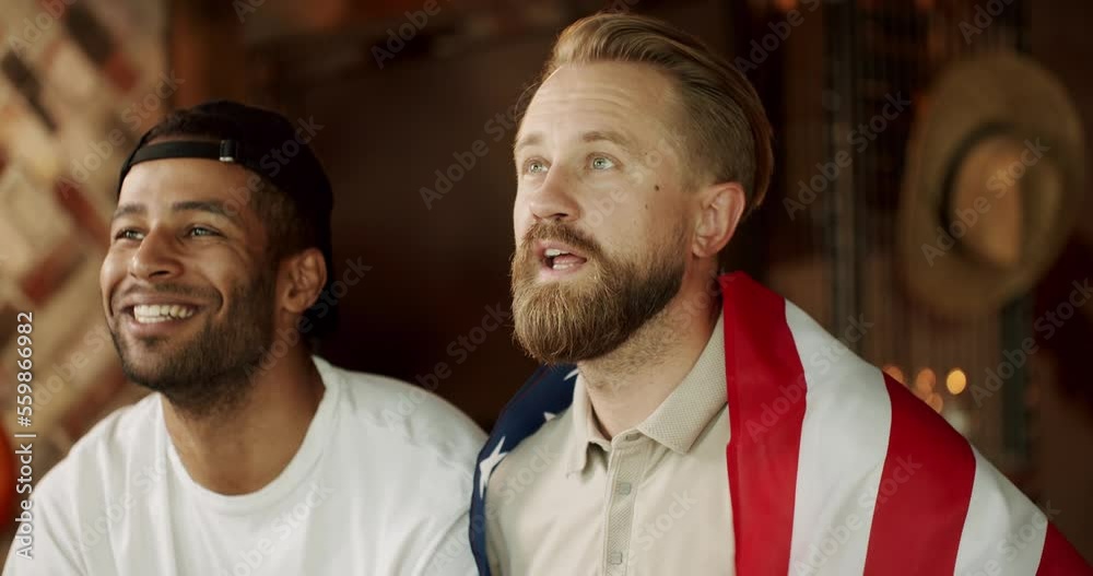 The fans are worried about losing the team. The supporters are not satisfied with their beloved team. Frustrated fans watching how favorite team losing.Men with the flag of the national country of USA