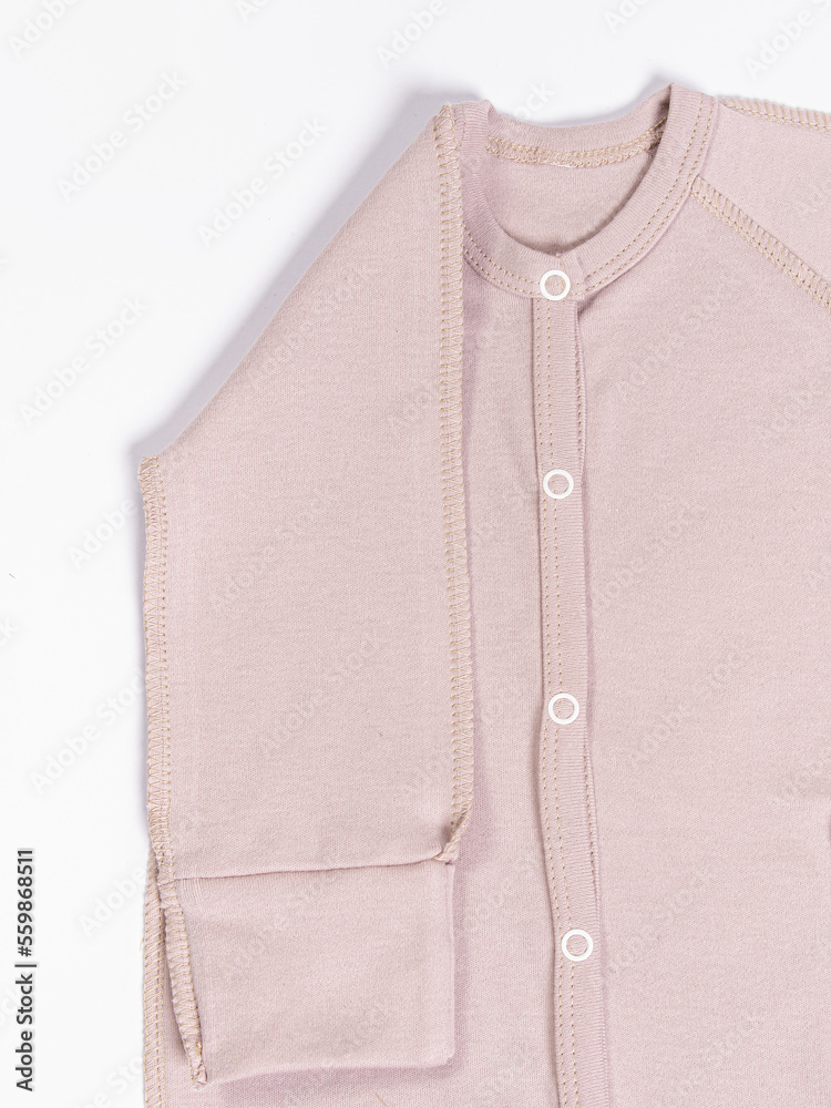 Cotton pink jumpsuit bodysuit for baby on white background. Long sleeve. Button-down jumpsuit for newborns Cotton pink jumpsuit bodysuit for baby on white background. Long sleeve. Button-down jumpsuit for newborns