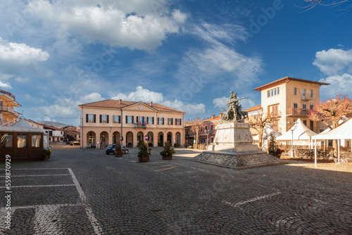 Peveragno, Cuneo, Italy - January 09, 2023: piazza Pietro Toselli with the town hall in neoclassical style and the monument to Major Pietro Toselli © framarzo