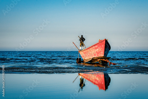 Photos Fisherman looking from the Boat on the Beach - Mazandaran, Iran