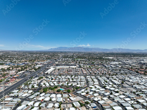 Aerial view across urban suburban communities in Las Vegas Nevada with streets, rooftops, and homes  photo