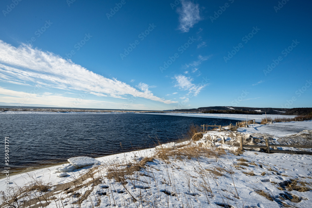 Fototapeta premium Shore of the St-Lawrence river seen from Godbout village on the North Shore