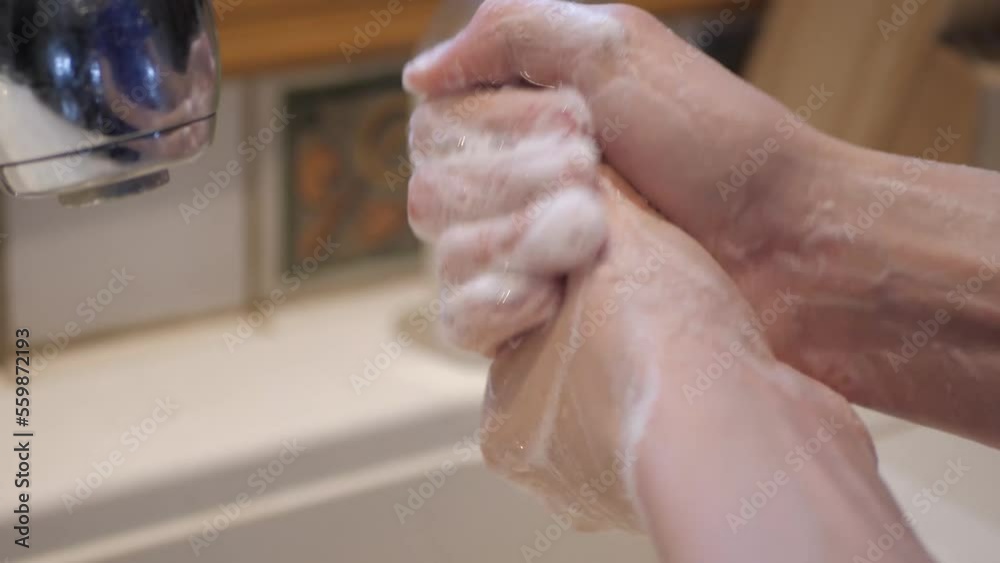 Washing hand close up bubbles