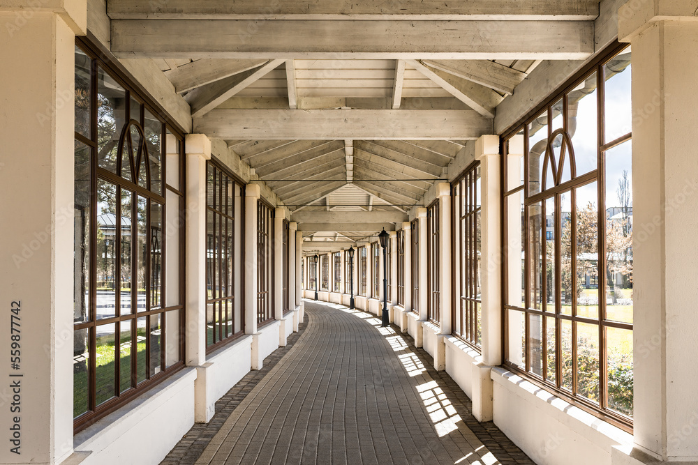 wooden corridor with windows