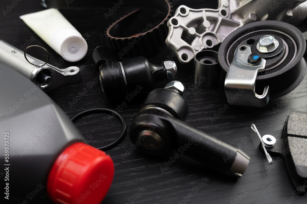 Auto parts spare parts car on black background. Auto parts store. Suspension and engine parts.