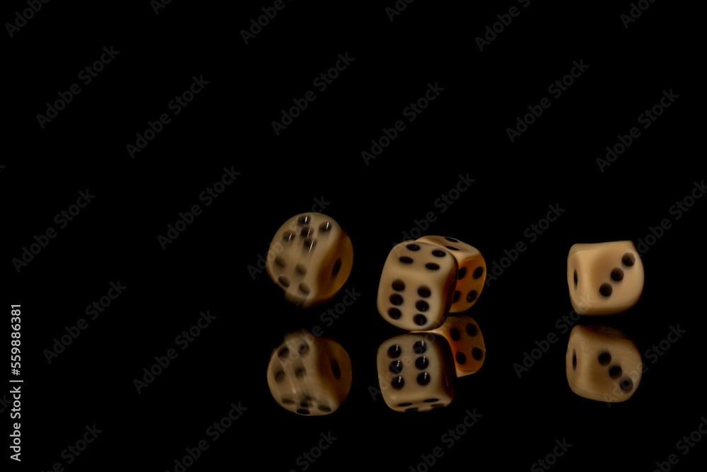 Game cubes on shiny black table with dark reflection Game cubes on shiny black table with dark reflection
