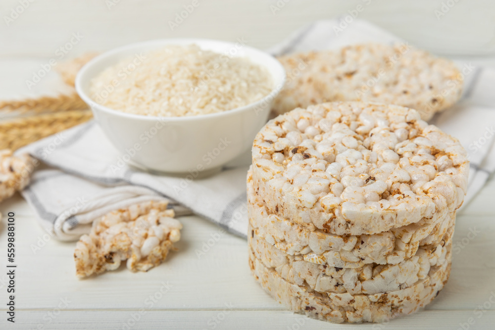 Stack of crispy rice cakes on white texture wood. Diet bread. Diet. proper nutrition. GLUTEN FREE. Copy space. Place for text. Stack of crispy rice cakes on white texture wood. Diet bread. Diet. proper nutrition. GLUTEN FREE. Copy space. Place for text.