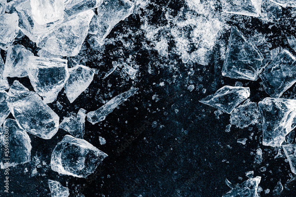 Ice cubes and crushed ice pieces on black background. Chill backdrop. Ice cubes and crushed ice pieces on black background. Chill backdrop.