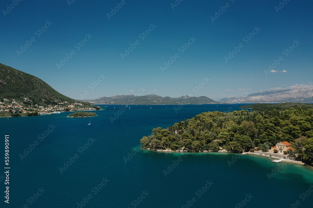 Popular Tourist destination. Bay with boats on Lefkada island. Nydri village.