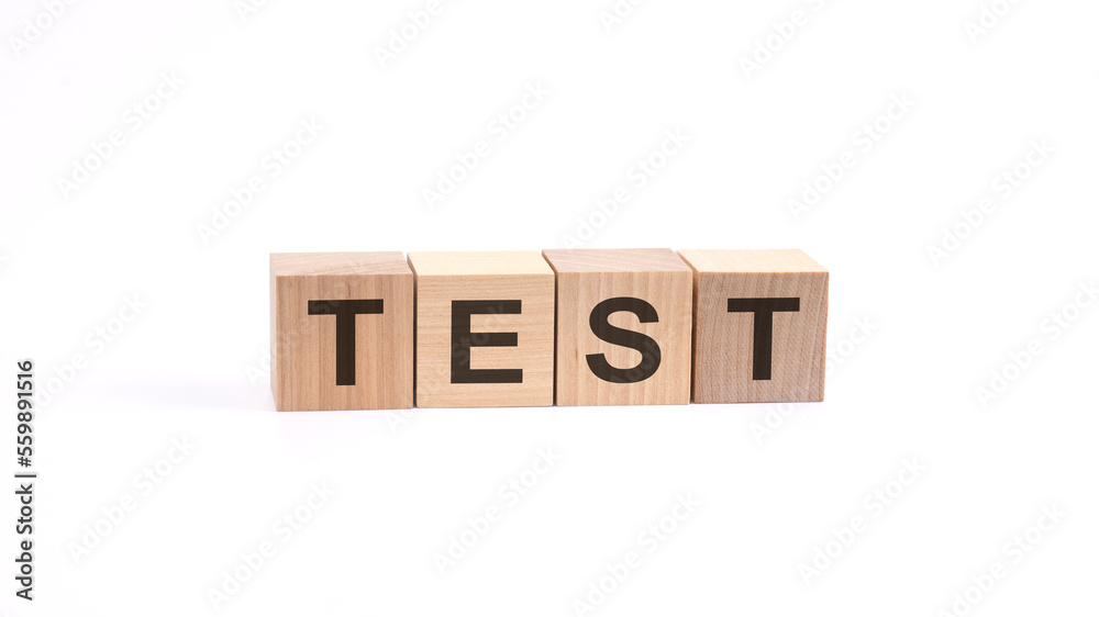 TEST inscription on wooden cubes isolated on white background TEST inscription on wooden cubes isolated on white background