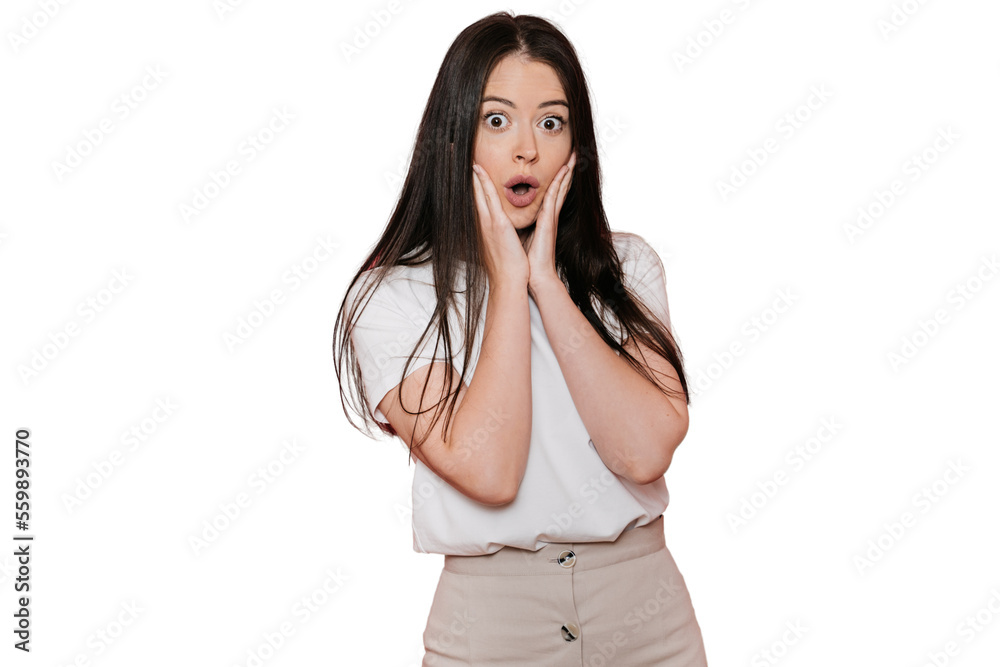 Shocked young brunette wonman in casual with wide opened eyes and mouth puts palms on cheeks in surprised expression against transparent background. Discount, sale. Amazed European girl in disbelief. Shocked young brunette wonman in casual with wide opened eyes and mouth puts palms on cheeks in surprised expression against transparent background. Discount, sale. Amazed European girl in disbelief.