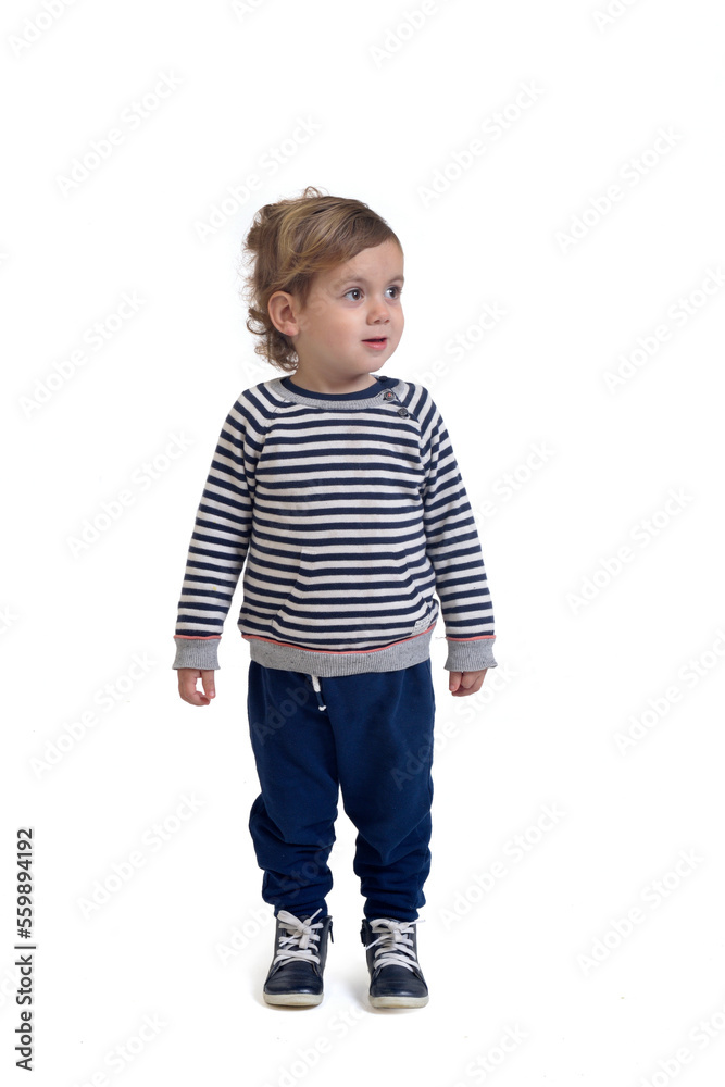 baby boy standing and looking away on white background baby boy standing and looking away on white background