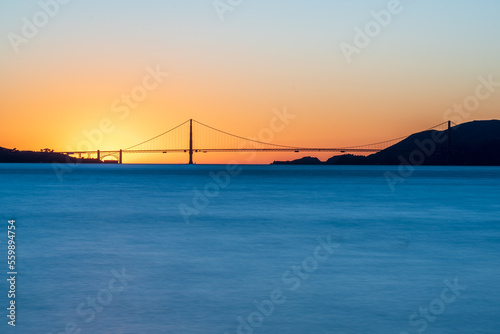 golden gate bridge at sunset photographed from tresure island