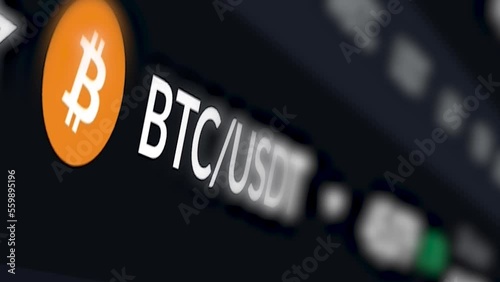 Bitcoin’s acronym and logo are shown on a computer screen
