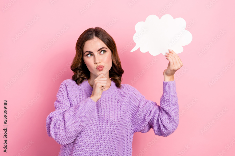 Photo of adorable clever concentrated focused lady wear stylish purple clothes hold paper empty space isolated on pink color background Photo of adorable clever concentrated focused lady wear stylish purple clothes hold paper empty space isolated on pink color background