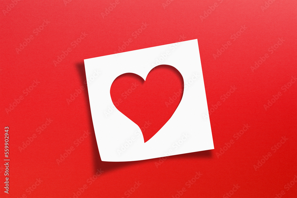 Heart shaped on note paper with red background Heart shaped on note paper with red background
