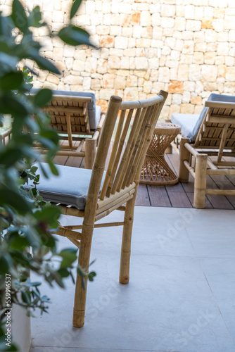 Chair and empty sun loungers in a hotel swimming pool