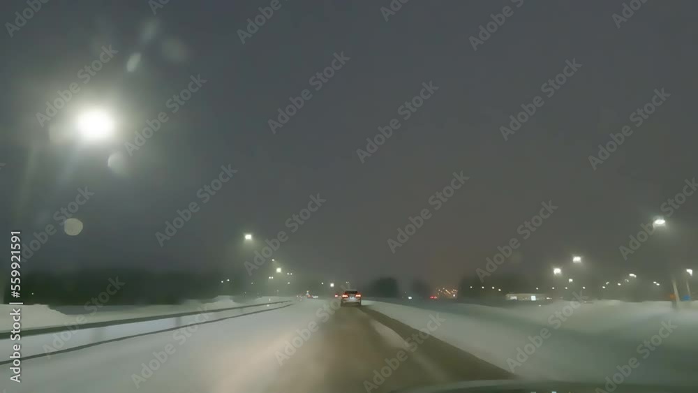 Stylized Cartoon Animation Video of car driving on highway through winter city street, dark time of day, snowfall. Stylized Cartoon Animation Video of car driving on highway through winter city street, dark time of day, snowfall.