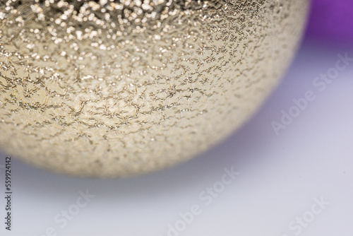 Golden Christmas ball with glitter close up macro