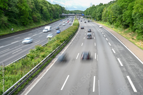 Blurred Cars on highway during rush hour in city. Driving car. Automobile driving on freeway. Moving cars, buses. © Ajdin Kamber