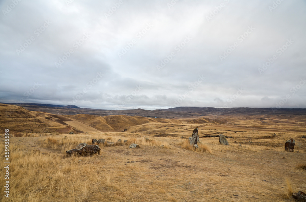 Obraz premium Zorats Karer (Carahunge) a complex of vertically standing basalt stones standing on a mountain plateau site near the town of Sisian in the Syunik Province of Armenia