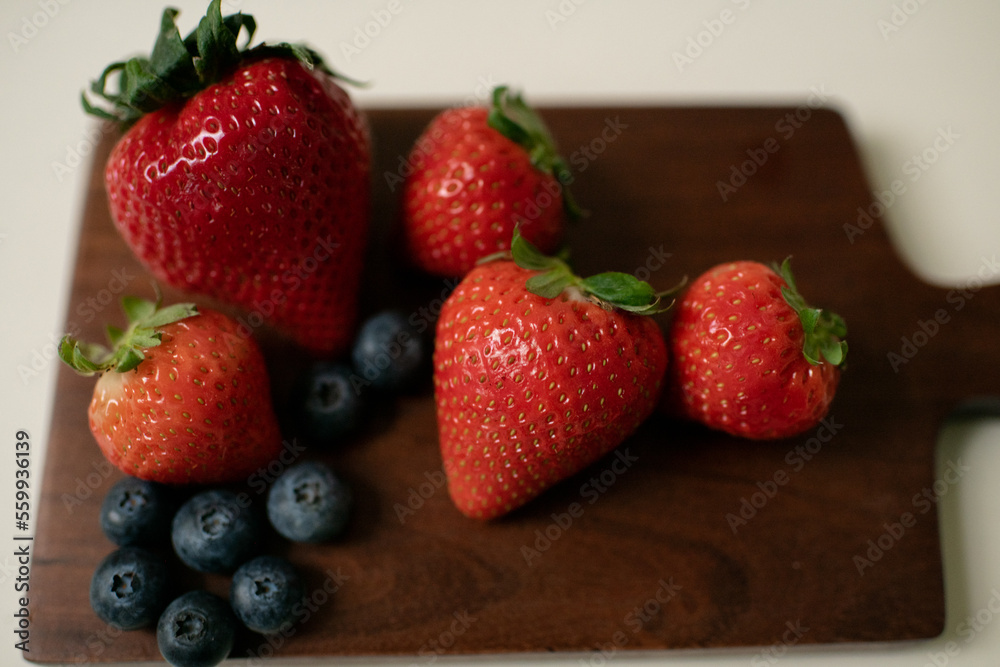 Fresh Fruit on Charcuterie Board in Kitchen Fresh Fruit on Charcuterie Board in Kitchen