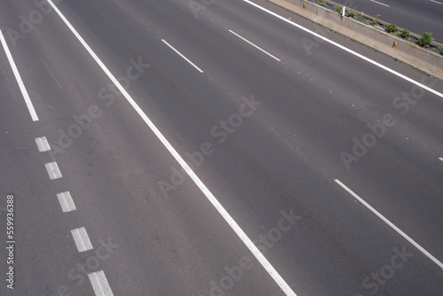 Road markings, marking different lanes, asphalt floor of a highway © Cavan