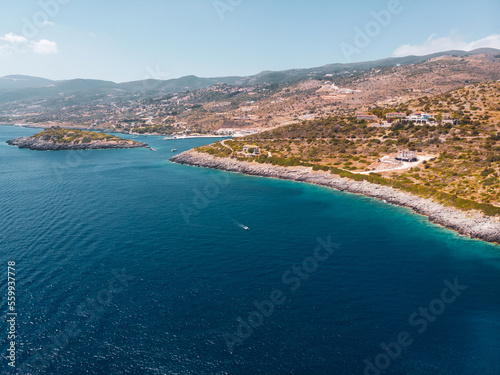 Fototapeta Naklejka Na Ścianę i Meble -  Drone shot of Zakynthos island with beautiful turquoise Ionian sea and limestone cliffs near famous Navagio beach during daytime